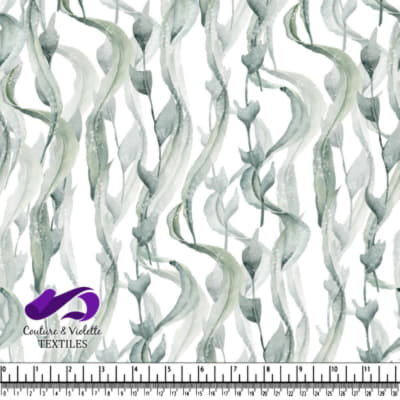 Vertical green seaweed strands on white background