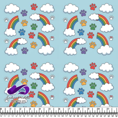 Colorful paw prints and rainbows with clouds pattern on blue background