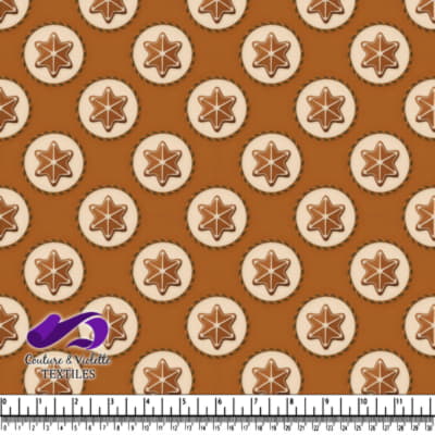 Star-shaped cookies on a brown background with textile branding