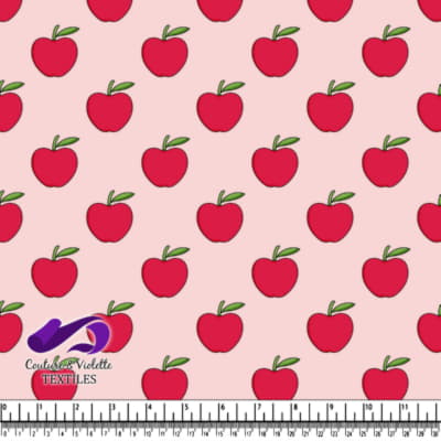 Red apples with green leaves on light pink background textile design