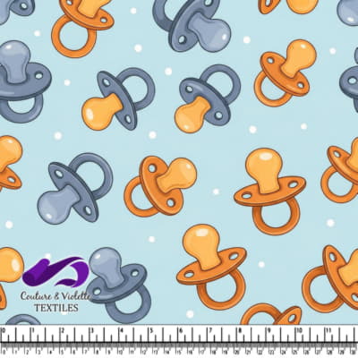 Motif de tétines de bébé sur fond bleu