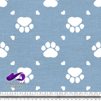 Cat - paws surround by littles hearts on clear sky blue texture